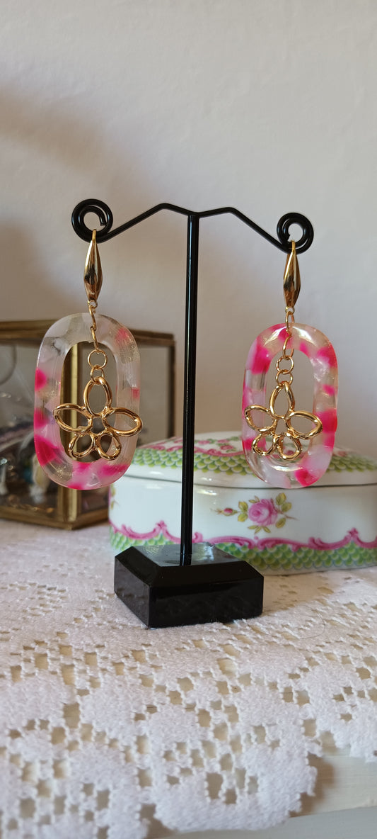 Boucles d'oreilles en acétate ovale avec marguerite au centre et  de couleur rose